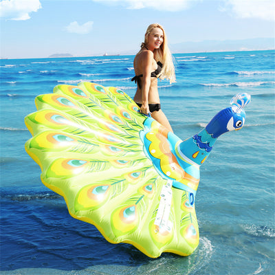 A Peacock Floats An Inflatable Toy On The Water